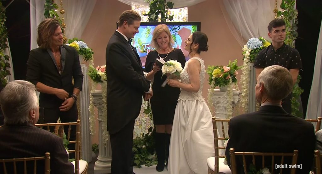 The pastor performs Tim and Toni's marriage ceremony